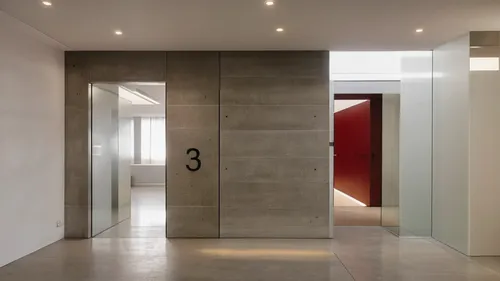 minimalist modern shared hallway with elevator and staircase,hallway space,exposed concrete,sliding door,modern minimalist bathroom,walk-in closet,hinged doors,metallic door,interior modern design,sho