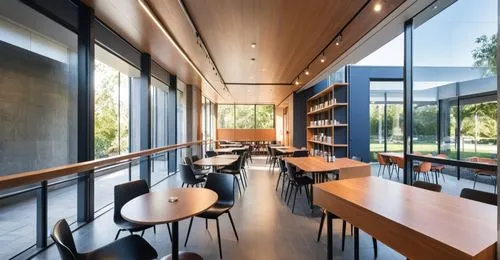 INTERIOR DE UNA BIBLIOTECA, PERSONAS ESTUDIANDO, DOBLE ALTURA,,a room with tables and chairs inside of it,school design,lecture room,study room,modern office,reading room,lecture hall,Photography,Gene