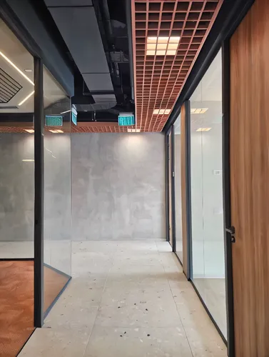hallway space,prefabricated buildings,recessed,wall completion,conference room,room divider,core renovation,concrete ceiling,modern office,meeting room,structural plaster,sliding door,ceiling construction,corten steel,daylighting,hallway,offices,the server room,corridor,exposed concrete