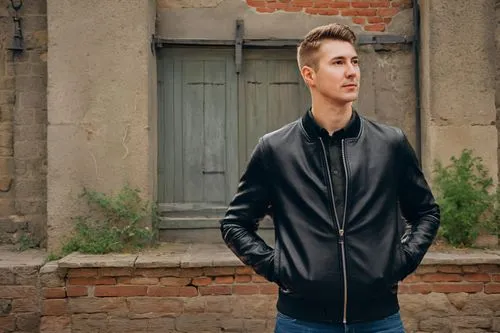 leather jacket,bolero jacket,outerwear,pompadour,brick wall background,red brick wall,jacket,male model,men's wear,portrait background,brick background,black coat,old coat,national parka,city ​​portrait,pomade,pocket flap,rockabilly style,farro,marroc joins juncadella at