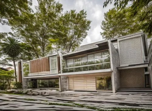 In a spacious masterful study, a minimalist house with a minimalist style exudes relaxation and beauty. The facade of the house is adorned with intricate concrete facades and plush carpet, with polish