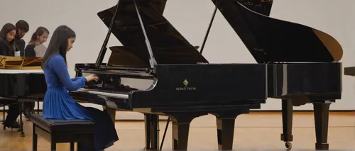 A talented young pianist captivates the audience at a crowded concert hall, her sweet melody touching the hearts of everyone.,steinway,grand piano,fortepiano,player piano,concerto for piano,the piano,