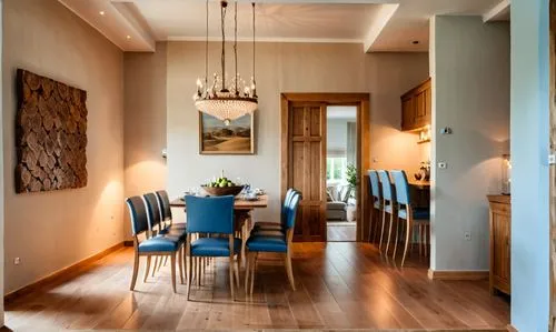 dining room, classic wall panels, lots of details, chandelier, fireplace with fire, open to below,a kitchen with blue chairs next to a dining table,dining room,contemporary decor,breakfast room,fromen