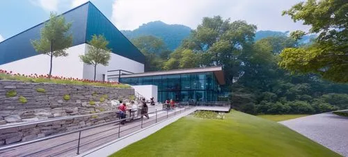 DISEÑO EXTERIOR DE UN RESTAURANT PARA UNA NAVE INDUSTRIAL, TERRAZAS CON MUROS DE PIEDRA, PERSONAS,CESPED, VENTANALES DE CRISTAL AMPLIOS, VISTAS PANORAMICAS, VEGETACION EXUBERANTE,an artist's rendering