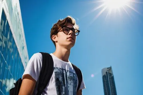 Miami, senior high school, architecture student, male, 18yo, short messy brown hair, black frame glasses, casual wear, graphic T-shirt, ripped jeans, sneakers, backpack full of books, standing, hands 