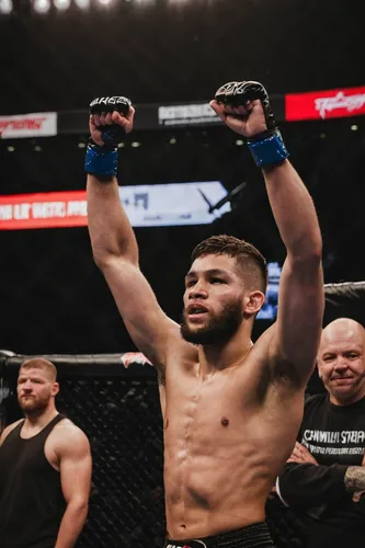 MMA Athlete Raises Hand in Victory | Zach Ancell Photography,striking combat sports,mma,ufc,mixed martial arts,combat sport,pankration,jeet kune do,austin champ,siam fighter,the warrior,bruges fighter