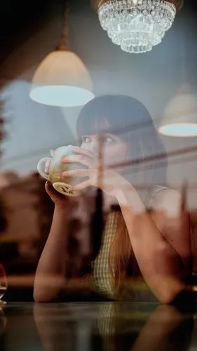 woman at cafe,woman drinking coffee,women at cafe,woman playing,bokeh,background bokeh