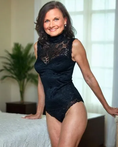 65yo  milf, short hair, wearing sleeveless lace pantygirdle, happy,woman with an interesting lingerie in a bedroom,feldshuh,michetti,lovinescu,hargitay,thighpaulsandra,szewczyk