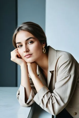 a woman sitting on top of a white table,birce akalay,shailene,marzia,maxmara,dua,shai