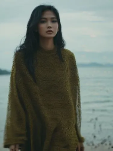 a pretty one,a woman with long hair wearing a green sweater standing next to the ocean,batanes,hyori,utada,anggun,sukarnoputri,haiyan,Photography,Documentary Photography,Documentary Photography 08