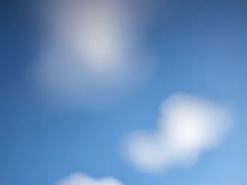 a kite in the sky on a clear day,abstract air backdrop,blur office background,defocus,cloud image,sky,pinhole