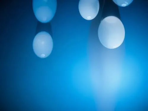 giger style,blue bubbles with one of the white ones floating on the water,bokeh lights,blue spheres,blue light,bokeh,bokeh pattern,blue lamp