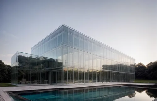 glass facade,structural glass,glass building,glass facades,glass wall,water cube,glass blocks,mirror house,glass pyramid,glass panes,archidaily,cube house,aqua studio,modern architecture,cubic house,glass pane,glass roof,plexiglass,reflecting pool,contemporary