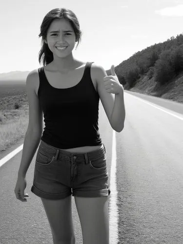 B&W high res photo: A poor-looking young woman stands at the side of the road with her thumb up, hitchhiking.,a woman standing in the middle of a road pointing at soing,hitchhiked,hitchhiking,hitchhik