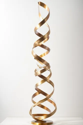 a sculpture made of wide tulle and gold lines that fall freely and spirally,dna helix,dna strand,helix,helical,double helix,dna,spiral binding,spiral,winding staircase,curved ribbon,spiralling,kinetic