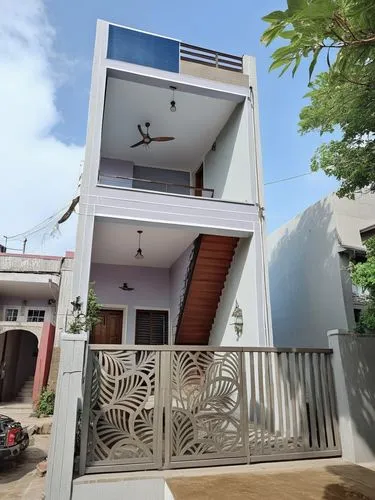 Paint this house with wonder lake, Sunita sun, and white colour ,a white building with an attached deck and gate,cubic house,pondicherry,cube stilt houses,cube house,inverted cottage,kulathuvayal,bloc