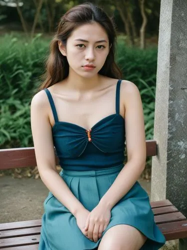 young japanese woman sits on a bench,an asian woman is sitting on a bench,xiaofei,yunjin,sihui,korean drama,yifei,xiaohui