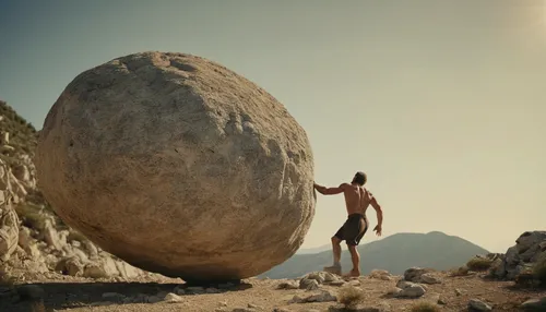 sisyphus greek heroe push levitating great stone to the mountain with own hands,balanced boulder,bouldering,boulders,stone ball,equilibrist,balancing act,rock climbing,gesture rock,rock climber,boulde