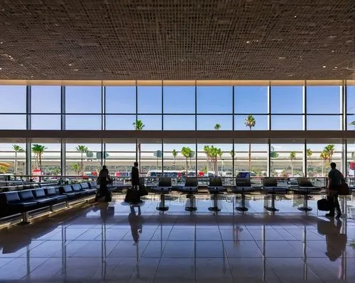 Modern LAX airport terminal, sleek glass facade, steel beams, minimalist design, open spaces, natural light pouring in, airy atmosphere, busy travelers, luggage carts, check-in counters, flight inform