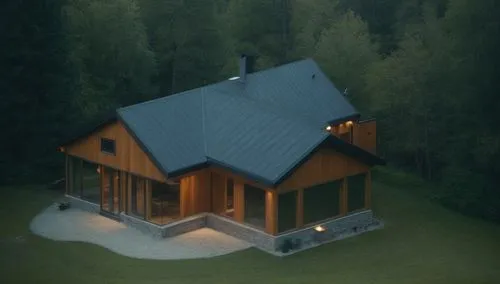 A simple and modern nordic wood cabin. ,the house is lit up in the evening light,the cabin in the mountains,house in mountains,small cabin,house in the mountains,house in the forest,log home,Photograp