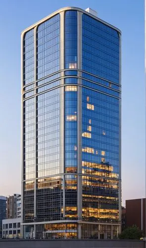 an illuminated, circular glass building stands in the evening,sandton,rotana,vdara,highmark,cira,potawatomi,Photography,General,Realistic