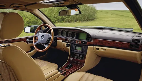 Describe the luxurious interior of a Mercedes W124 in an elegant setting.,rolls-royce phantom vi,rolls-royce phantom v,rolls-royce phantom i,rolls-royce phantom,bentley arnage,rolls-royce corniche,ben