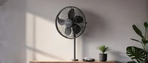 Modern living room, sleek wall-mounted oscillating fan, silver metallic body, circular shape, three blades, adjustable head, white grille, black cord, mounted on a light gray concrete wall, surrounded