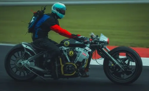 the rider wears blue, red and black clothing on a grey motorcycle,thruxton,kirkstead,snetterton,donington,silverstone,side car race,Photography,Documentary Photography,Documentary Photography 14