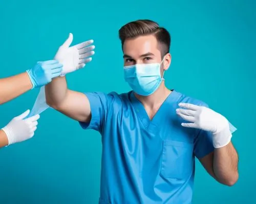 a man wearing a surgical mask and glove is standing with hands on his hips,surgical mask,hand disinfection,hygienists,health care workers,unsterile,anaesthetists