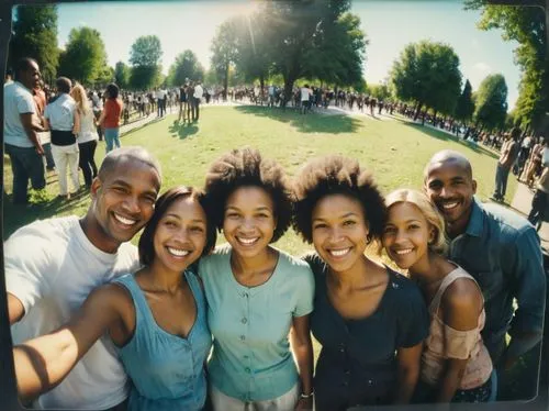 A number of people of different colors, races, ethnicity, age, standing together in a city park, smiles, happy, solidarity, facing viewer.,four adults and two children taking a picture in the park,gro