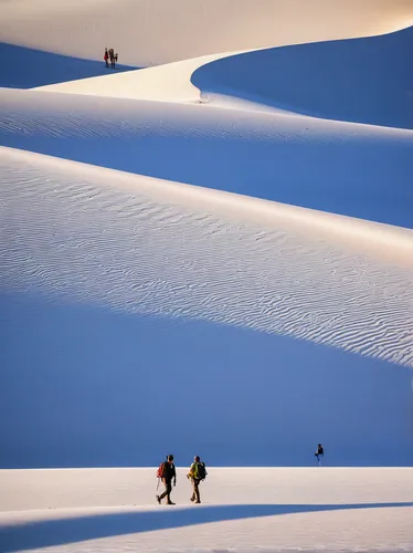 Hikers walk through the desert of White Sands National Monument,white sands dunes,colorado sand dunes,great sand dunes,crescent dunes,great dunes national park,white sands national monument,sand dunes