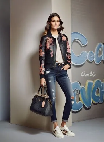 Fashion show ,a woman wearing jeans and sneakers stands next to a wall with graffiti,cavalli,escada,ceca,cari,coolbrands,social,Photography,General,Commercial