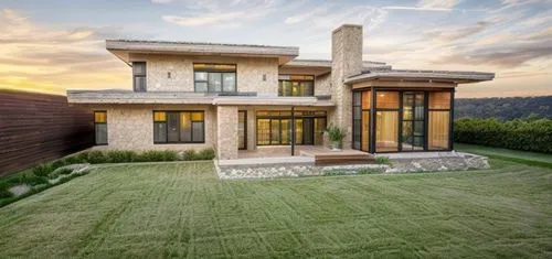 Well kept short green lawn in the foreground with strands of long dry grass to add character. Place outdoor furniture to give the impression of a social outdoor space with planters to add to the chara