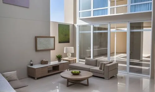 an empty living room filled with furniture next to tall windows,modern living room,family room,habitaciones,contemporary decor,hovnanian,home interior