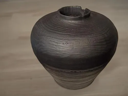 объект находится на деревянном столе светлого оттенка,the dark gray vase sits on top of a table,clay jug,vase,bizen,two-handled clay pot,copper vase,udu