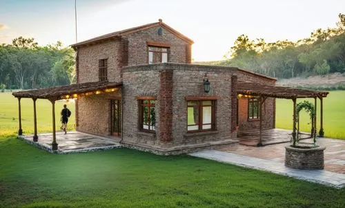 Residencia familiar de campo
Materiales: madera + acero + vidrio + ladrillos vistos  
Agregar entorno: plantas + flores + pajaros + mariposas +  personas,a brick house that is surrounded by grass,3d r