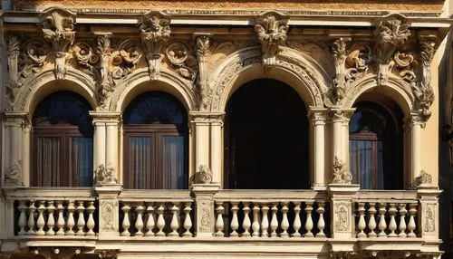 Italian Renaissance architecture, grandeur, ornate decorations, arches, columns, domes, symmetrical facade, marble, stone carvings, rusticated quoins, classical orders, Corinthian capitals, volutes, s