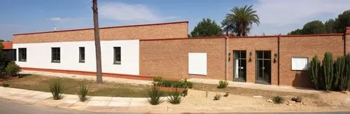 CREATE A FACADE INSPIRED BY A MEXICAN HACIENDA WITH TEXTURES AND PLACE 3 WINDOWS WITH RED BRICK FRAMES SOFT SHADOWS AND WARM SUMMER LIGHT,a building with three stories and green trees,interhostel,fpcc