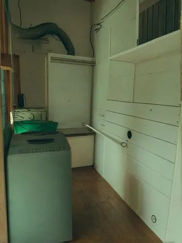 laundry room,vintage kitchen,storage cabinet,kitchen cart,cabinets,cabinetry,kitchenette,kennel,assay office in bannack,refrigerator,basement,kitchen interior,door-container,treatment room,restored ca