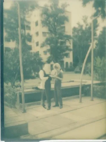 three people standing next to each other on a walkway,polaroid photos,persiaran,instamatic,polaroid pictures,pinhole,pictorialist,Photography,Documentary Photography,Documentary Photography 03