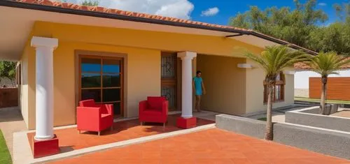 UNA CASA ESTILO MEXICANO, CON COLORES VIBRANTES, USO DE CANTERA,PISOS DE BARRO ROJO, TABIQUE Y ELEMENTOS REGIONALES MEXICANOS, UBICADA EN UN ENTORNO CAMPIRANO, CON COLUMNAS CIRCULARES DEE CONCRETO, AR