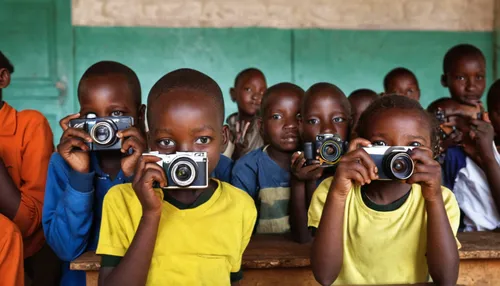 Children at Intimigom School in Kenya learn to use a digital camera, supported by The Kilgoris Project.,photographing children,children of uganda,photos of children,people of uganda,photographers,pict