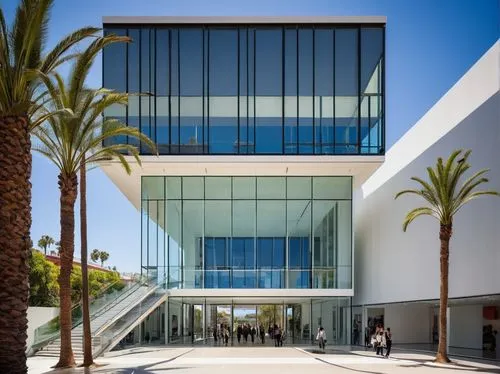 Mak Center for Art and Architecture, modern building, glass façade, steel structure, minimalist interior, white walls, wooden floors, grand staircase, open atrium, natural light pouring in, exhibition