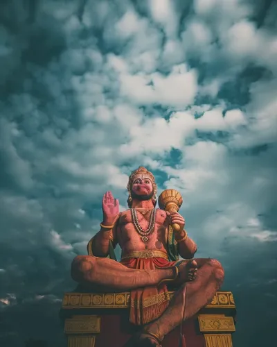 a man is sitting on top of an item and praying,parashurama,hanuman,hanumanji,chandraswami,kartikeya,vardhana