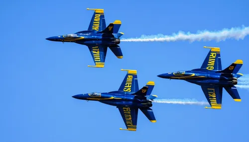 Create a poem capturing the grace and precision of the Blue Angels' aerobatic maneuvers.,blue angels,reno airshow,airshow,air show,formation flight,aerobatics,aerobatic,defense,air racing,flugshow,wal