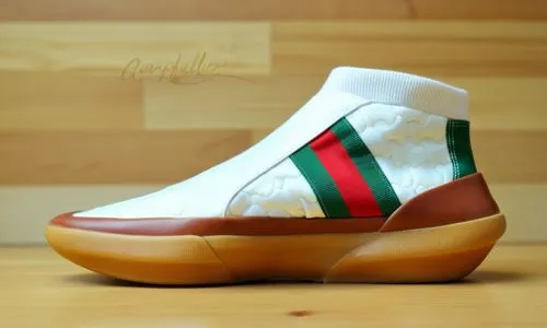 White sock upper, tan leather croc vamp with green and red nylon band, white sole and gum trim, wood background ,a white sneaker with green and red stripes on the side,guccis,famu,neapolitan,gucci,ter