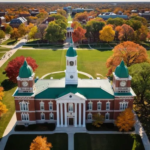 Mizzou University campus, Gothic Revival style, iconic Jesse Hall, stunning clock tower, red brick exterior, white stone trim, green copper roof, sprawling lawn, blooming trees, students walking, sitt