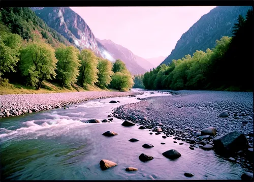 Mountain river, serene landscape, majestic mountains, snow-capped peaks, gentle flowing water, rocky riverbanks, lush green vegetation, misty atmosphere, soft morning light, panoramic view, 3/4 compos