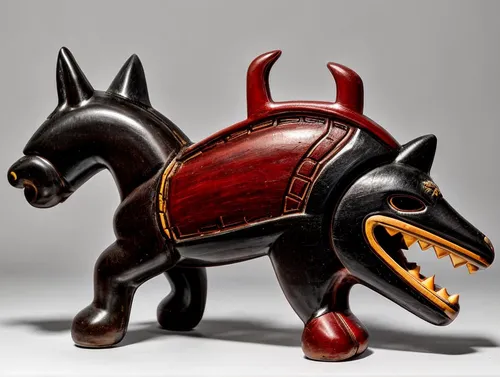 this ceramite that has the shape of a horse,toy manchester terrier,animal figure,tribal bull,english toy terrier,oxcart,scottish terrier,oxpecker,chinese imperial dog,capitoline wolf,schutzhund,old en