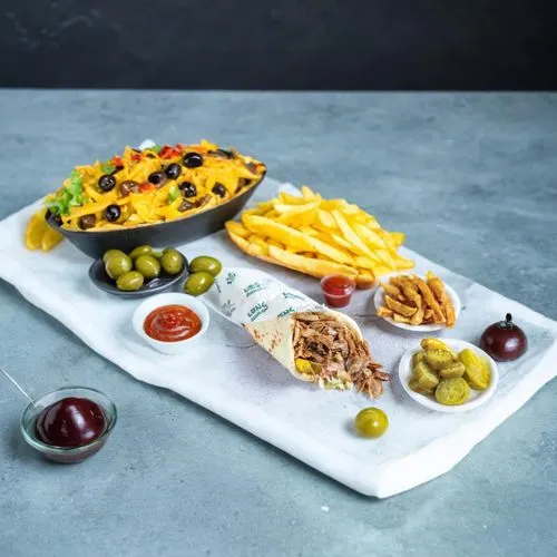 a meal with various foods and sauces displayed on a white plate,cheese plate,platters,mezze,hamburger plate,cheese platter,mediterranean cuisine